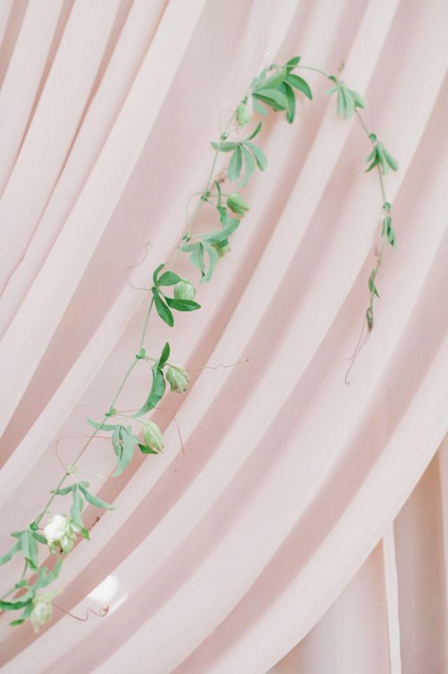Vine with leaves on a pink curtain for Jennifer & Lars' Wedding