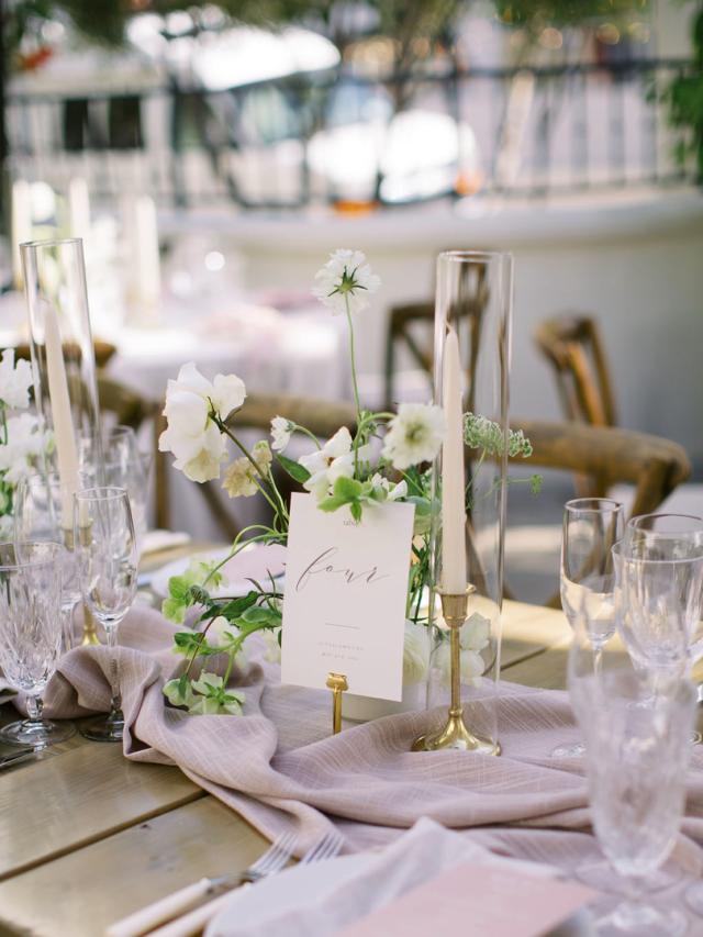 Mid cross view of placemat with flowers and pink napkins for Jammie & Duncan's Wedding