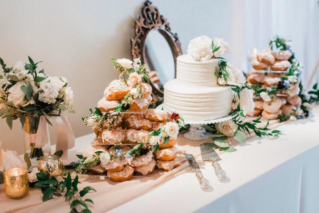 Table with wedding cake and donuts for Jennifer & Lars' Wedding