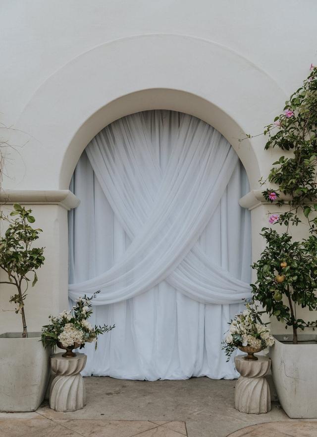 Archway with curtains and flowers for Ivanka & Victoria's Wedding