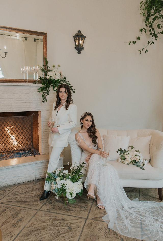 Married couple posing in front of fire for Ivanka & Victoria's Wedding