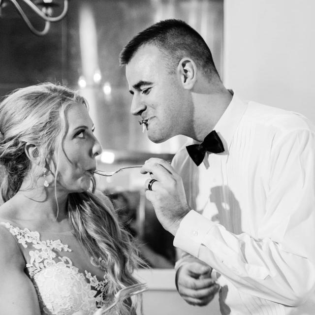 Bride & Groom Feeding Each Other at Stephanie & Grant's Wedding