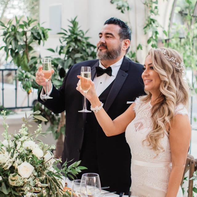 Bride & Groom Holding a Glass of Champaign at Evelyn & Gus' Wedding