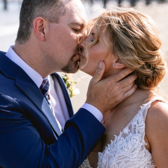 Bride and groom kissing outside for Danielle & Richard's Wedding