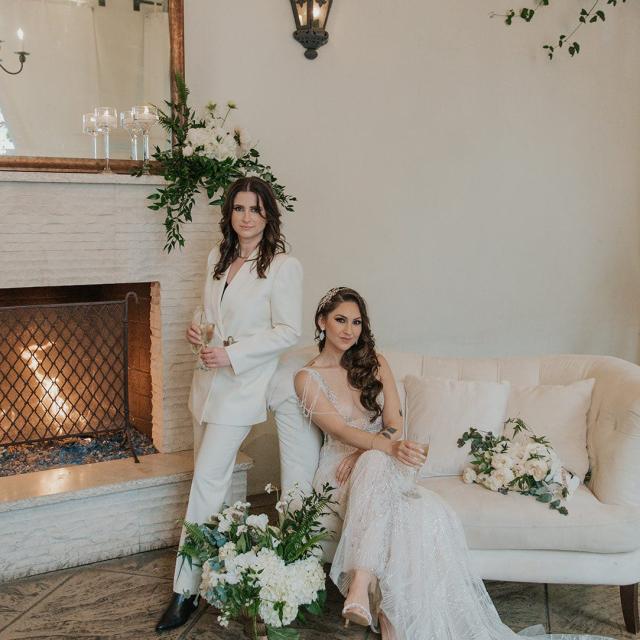Married couple posing in front of fire for Ivanka & Victoria's Wedding